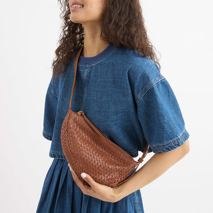 The Sak Tess Sling Bag in Woven Cognac Leather