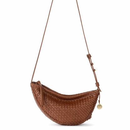 The Sak Tess Sling Bag in Woven Cognac Leather