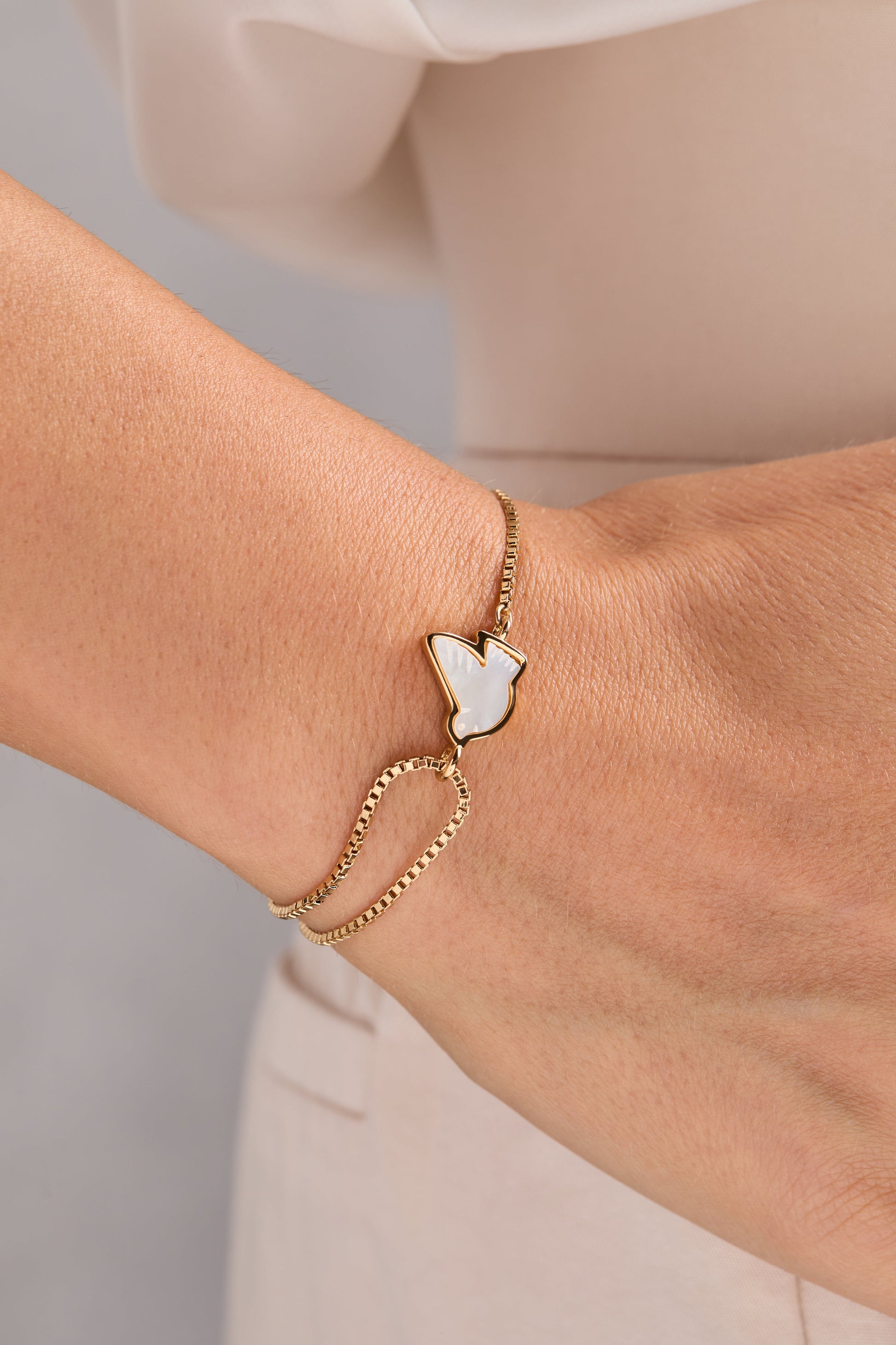 Pearlized Dove 'Peace' Pull Chain Bracelet Gold