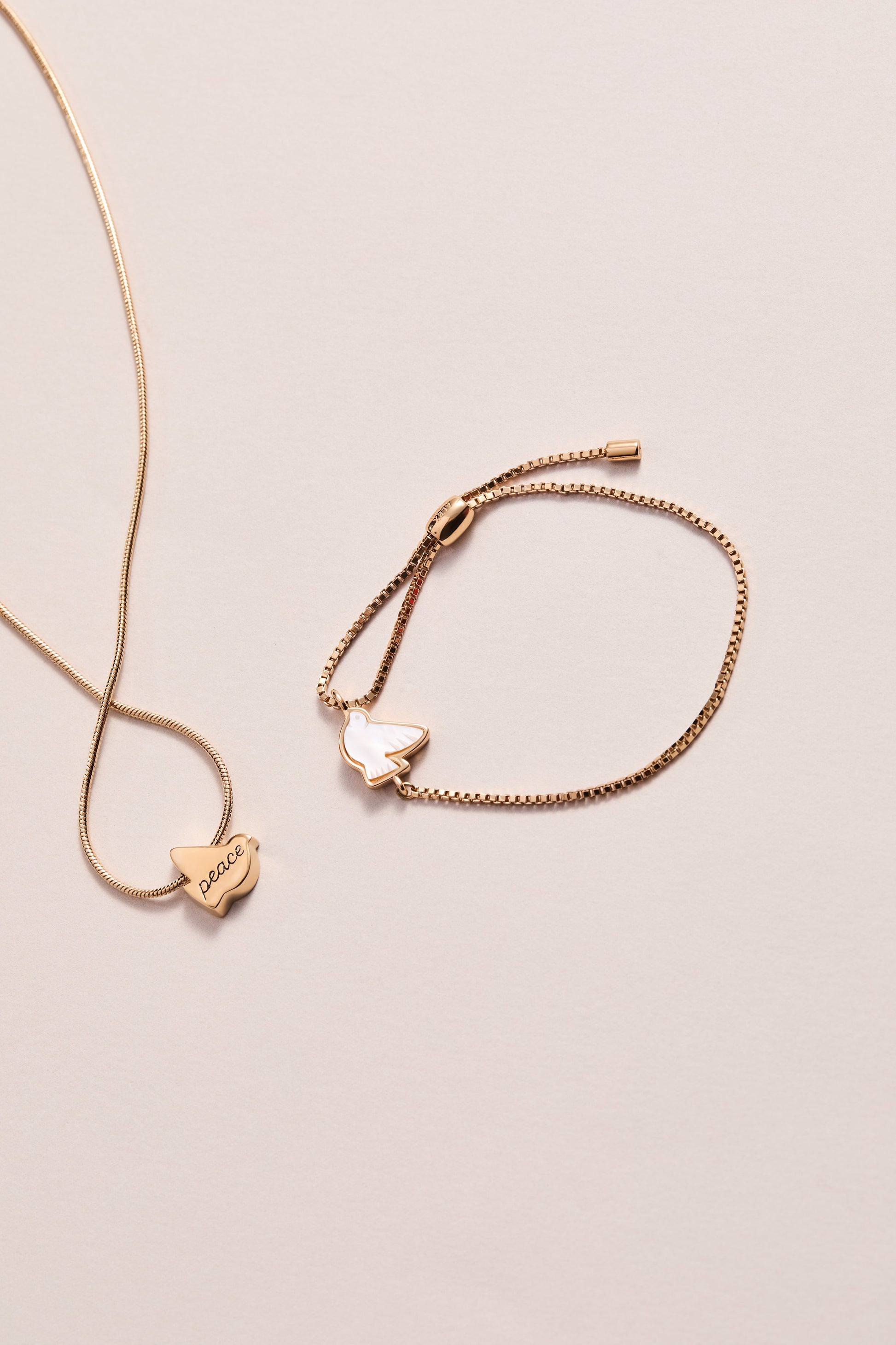 Pearlized Dove 'Peace' Pull Chain Bracelet Gold